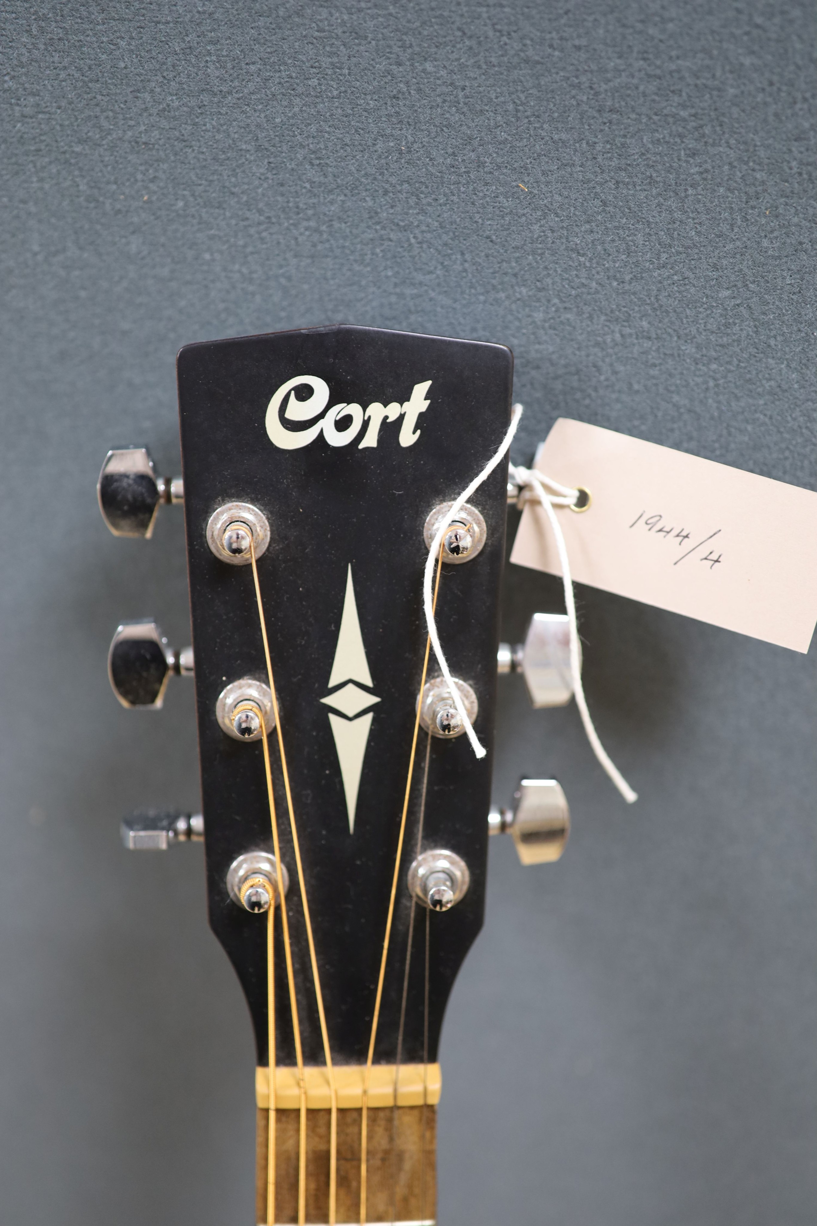 A Cort acoustic guitar